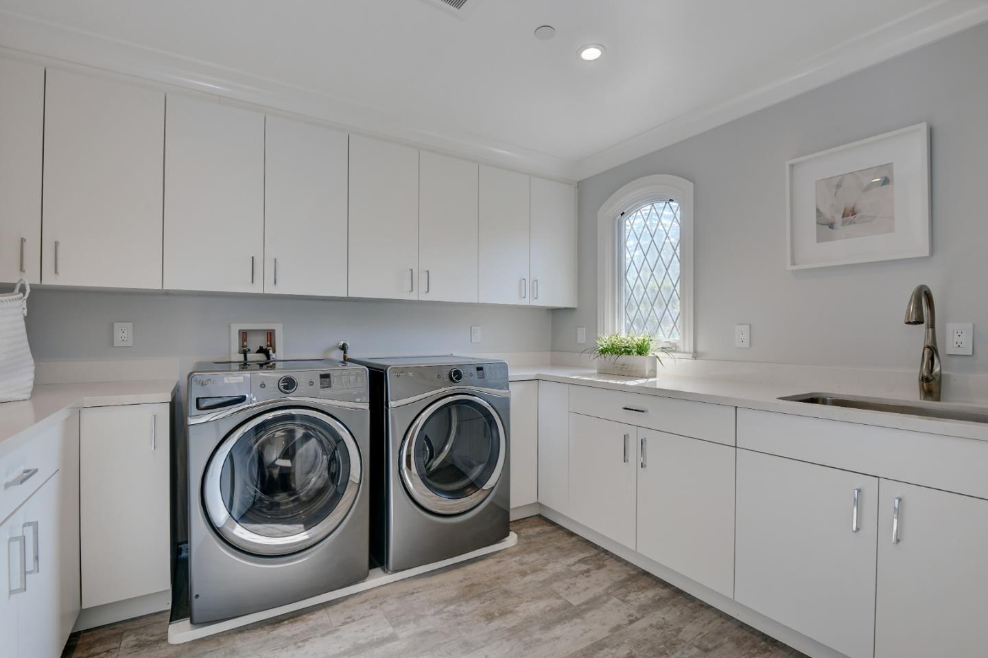 1025 Cabrillo Avenue Burlingame, CA 94010 - Photo 24 of 39 a utility room with sink dryer and washer