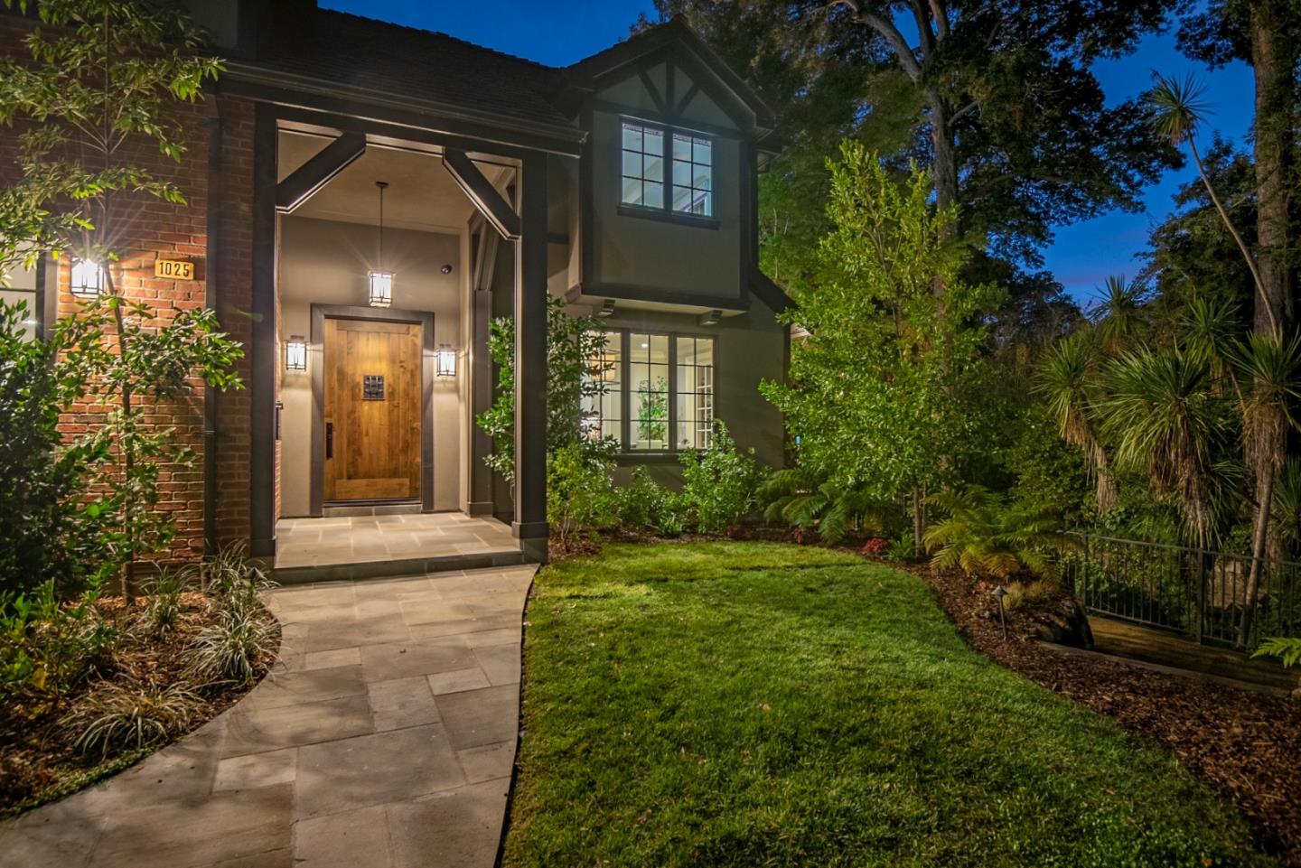 1025 Cabrillo Avenue Burlingame, CA 94010 - Photo 38 of 39 a view of a brick house with a yard