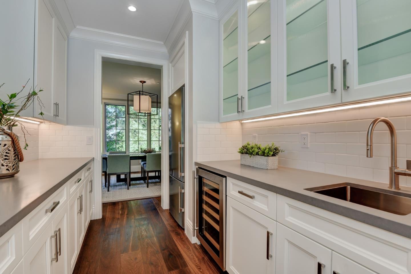 1025 Cabrillo Avenue Burlingame, CA 94010 - Photo 5 of 39 a kitchen with stainless steel appliances a sink stove and cabinets
