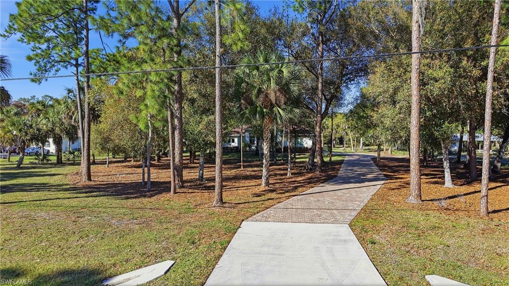 3707 5th Avenue Southwest Naples, FL 34117 - Photo 42 of 45 Long paver driveway