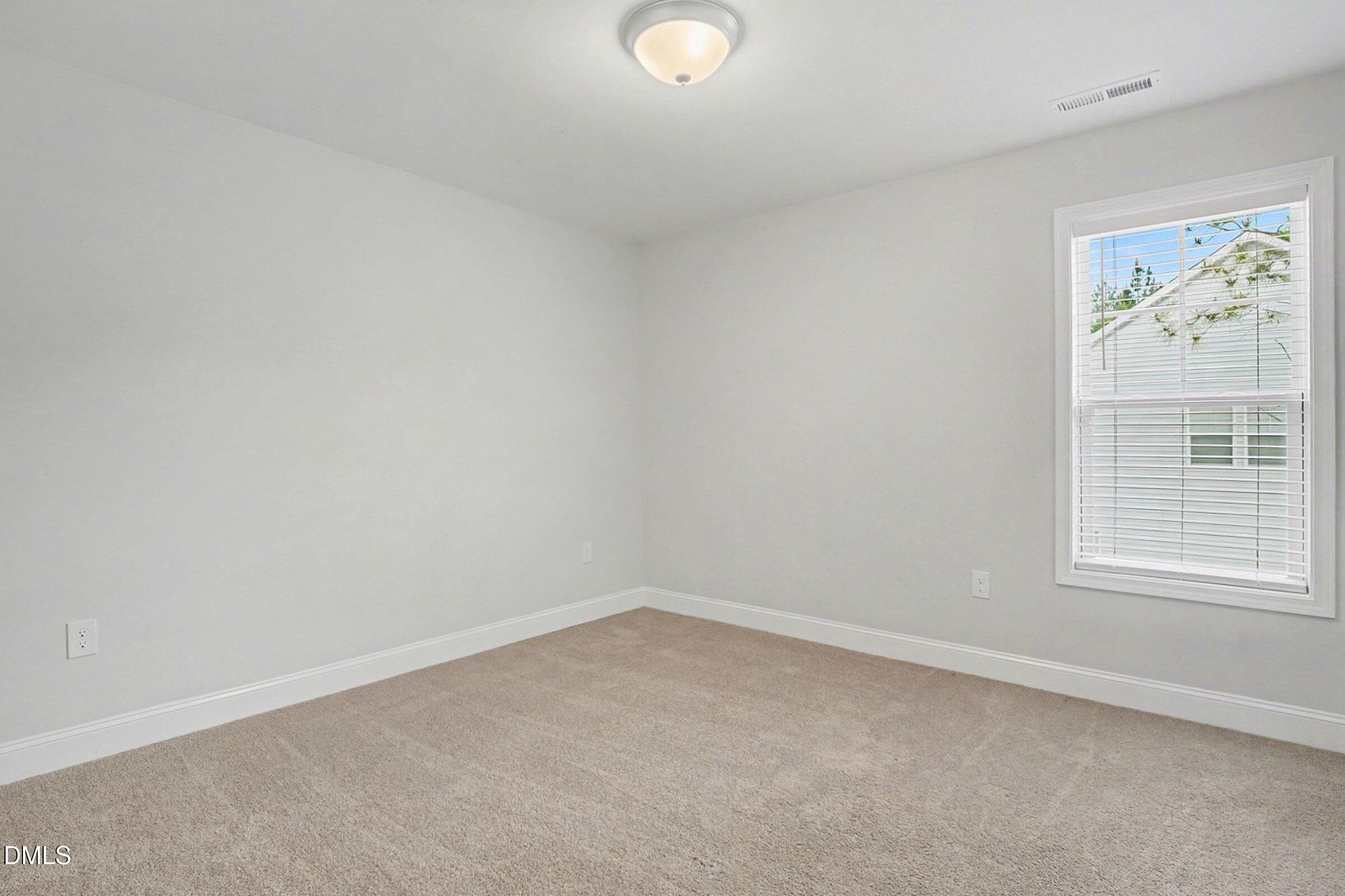 2815 Lemuel Black Road Spring Lake, NC 28390 - Photo 32 of 37 an empty room with windows