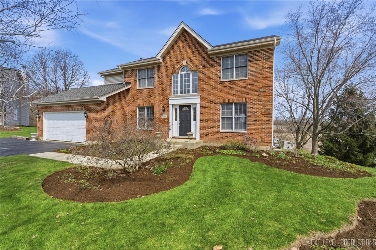 2984 Marshfield Court Elgin, IL 60124 - Photo 1 of 40 a front view of a house with a yard