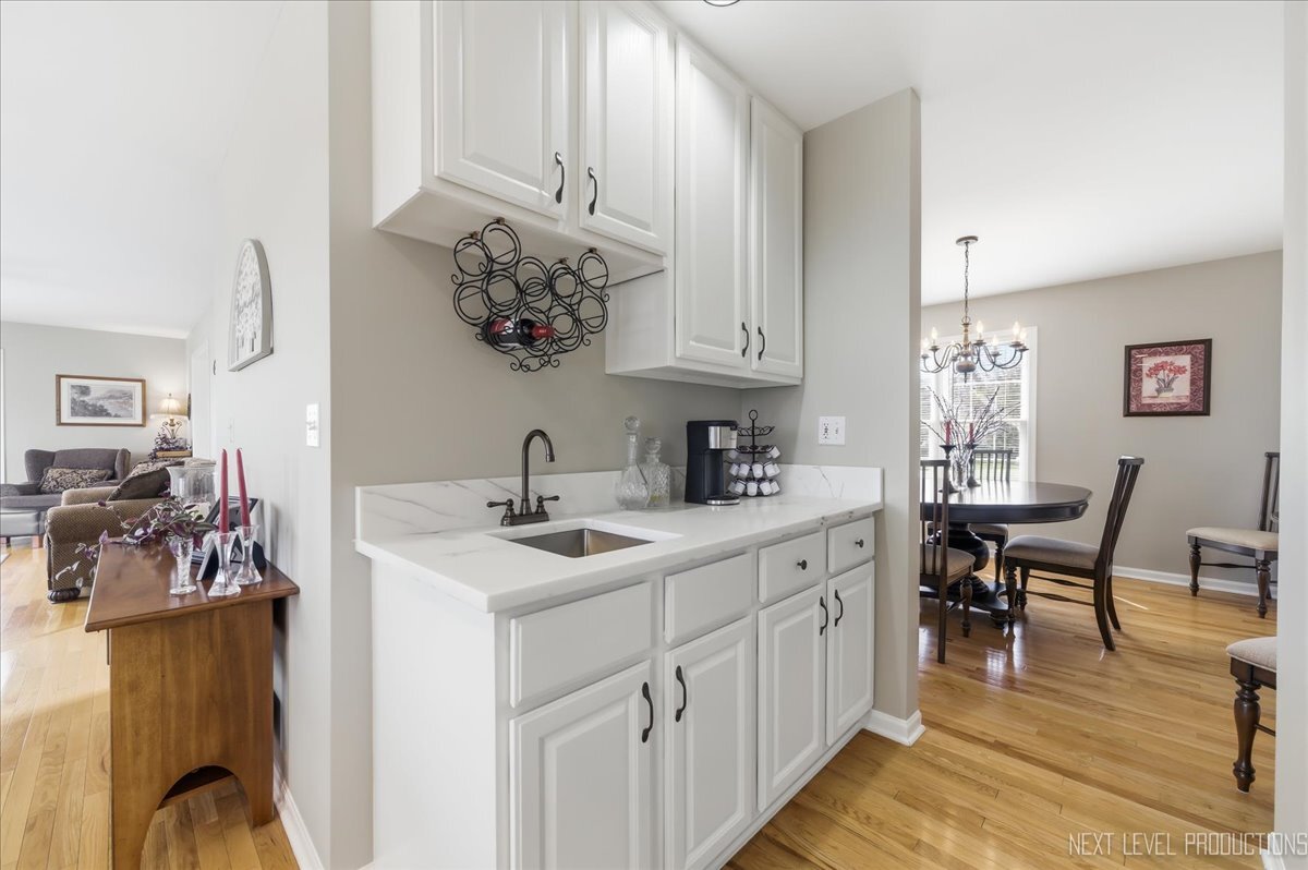 2984 Marshfield Court Elgin, IL 60124 - Photo 14 of 40 a kitchen with a sink and cabinets
