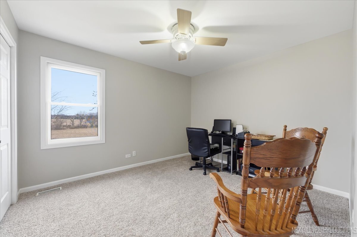 2984 Marshfield Court Elgin, IL 60124 - Photo 26 of 40 a workspace with chandelier fan and a window