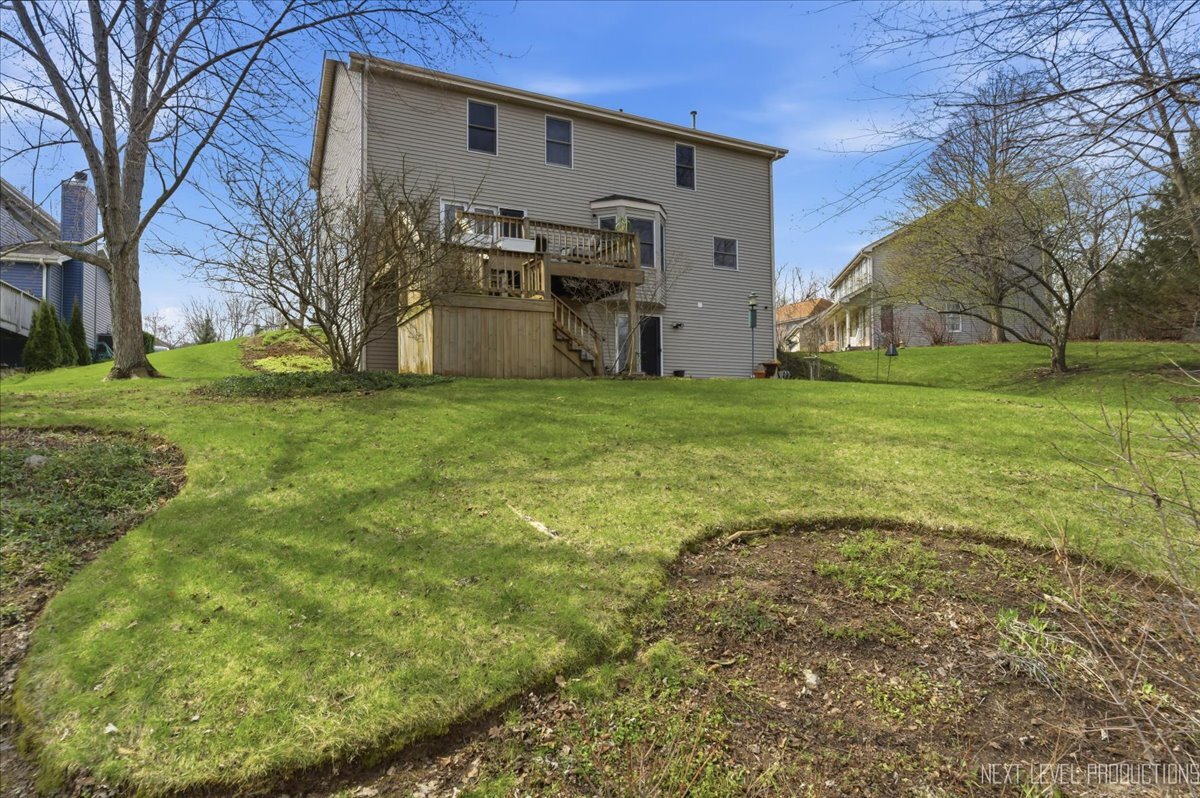 2984 Marshfield Court Elgin, IL 60124 - Photo 29 of 40 a backyard of a house with table and chairs