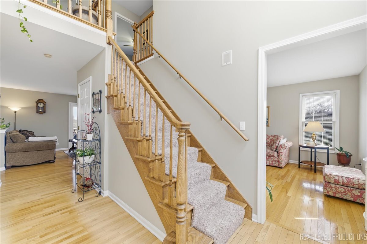 2984 Marshfield Court Elgin, IL 60124 - Photo 3 of 40 a view of entryway and hall with wooden floor