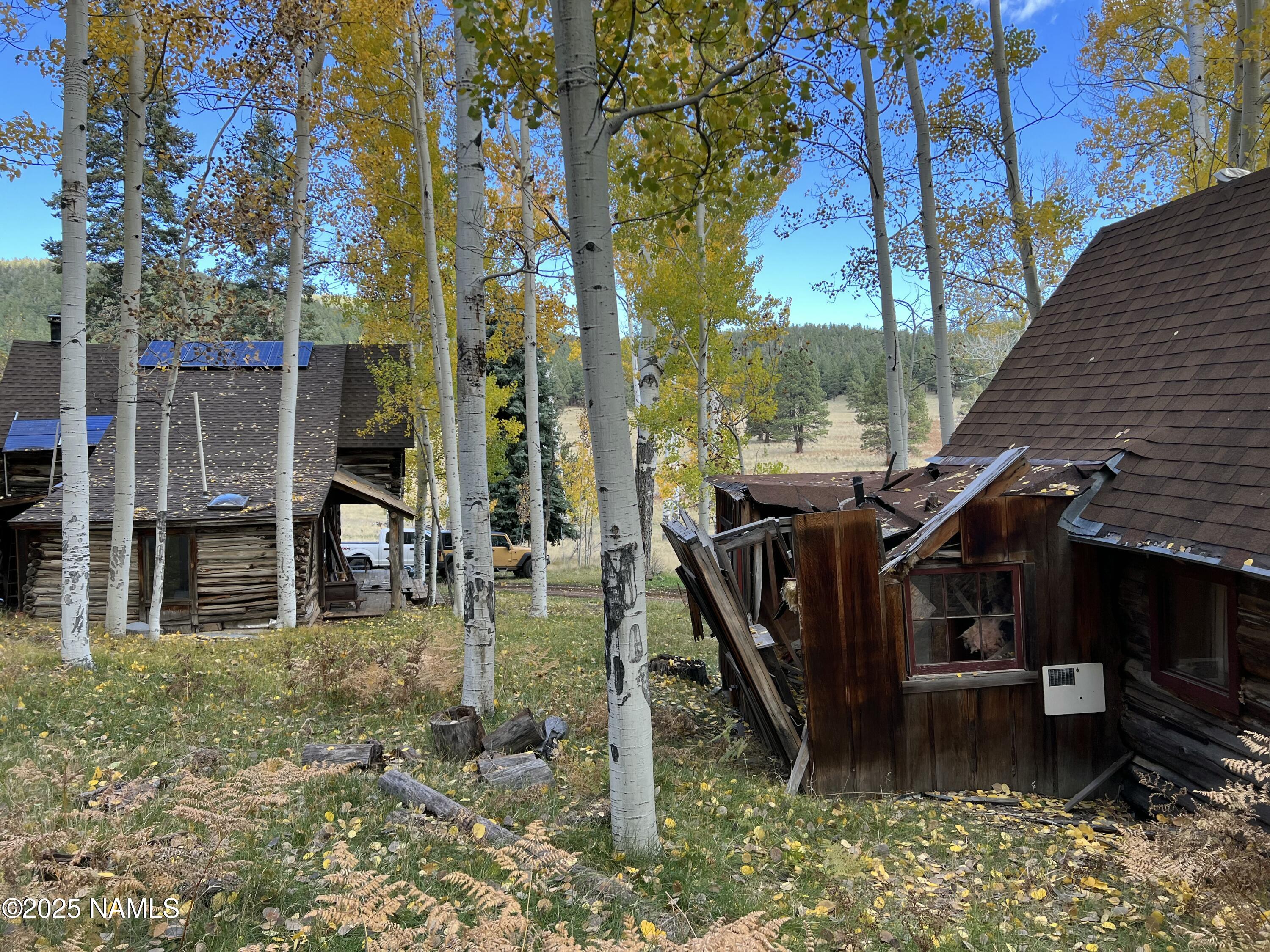 0 Forest Service 900 1k Road Northeast Flagstaff, AZ 86001 - Photo 5 of 25 a view of a house with backyard and sitting area