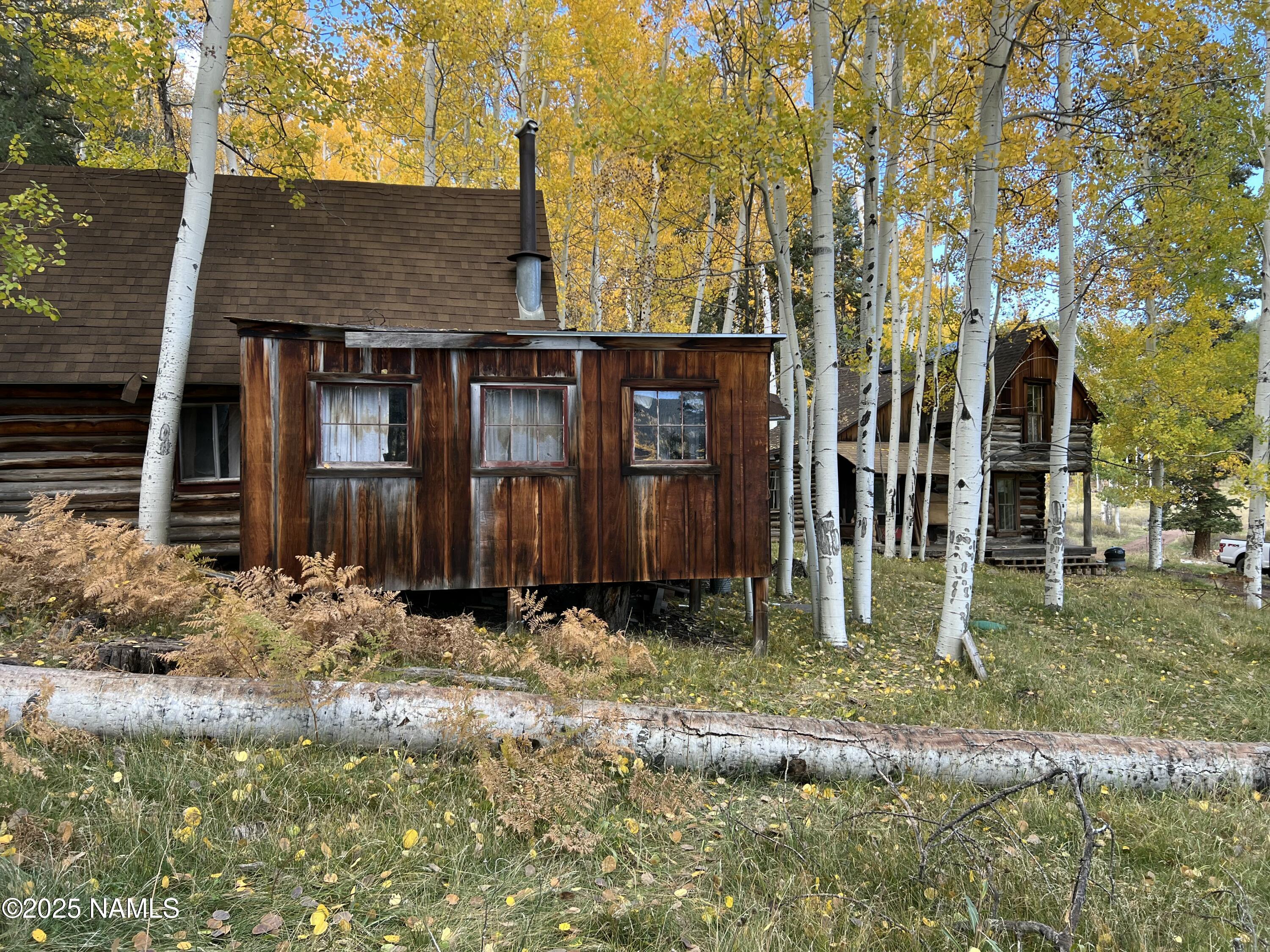 0 Forest Service 900 1k Road Northeast Flagstaff, AZ 86001 - Photo 10 of 25 front view of a house with a yard