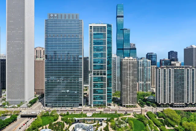 a front view of a building with a garden