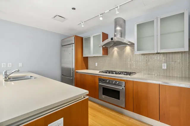 a kitchen with a stove and a sink