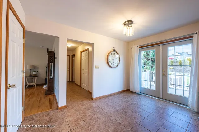 a bathroom with a sink a mirror and a window