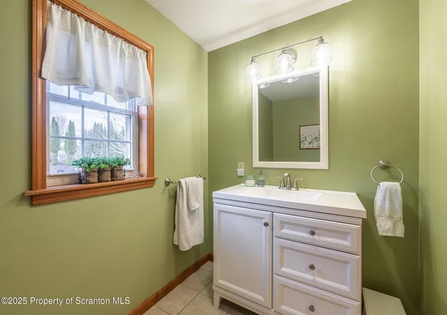 a bedroom with a bed and a lamp