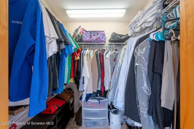 a bathroom with a sink a large mirror and a shower