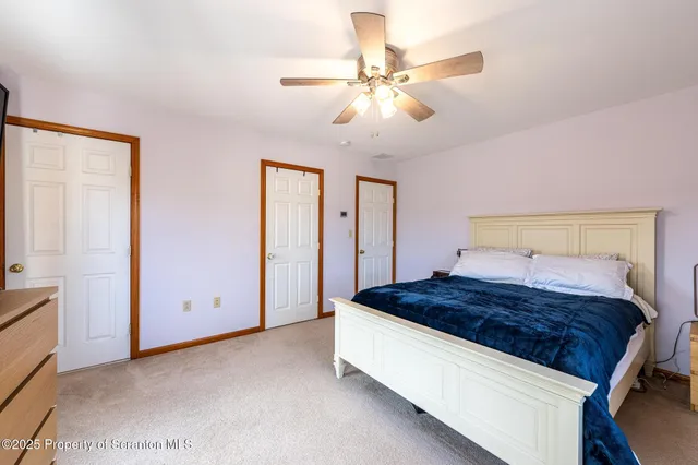 a living room with a couch and wooden floor