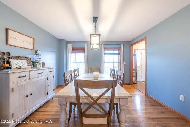 a view of a livingroom with furniture and wooden floor