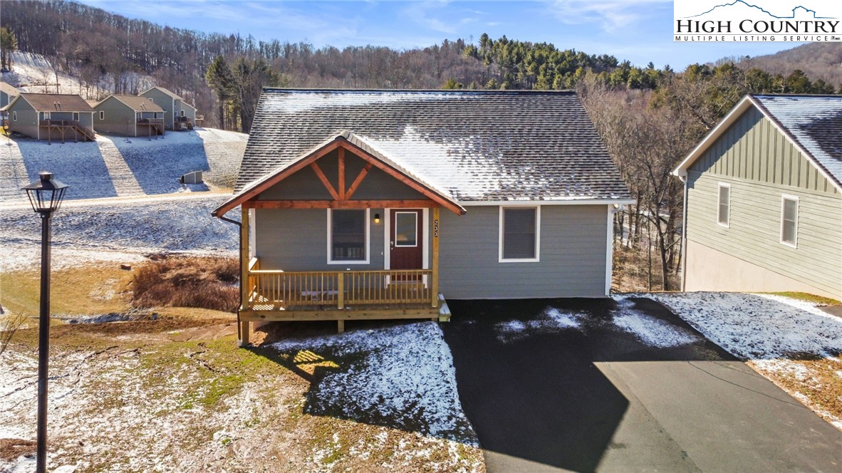 245 Ava Way, Unit 108 Boone, NC 28607 - Photo 2 of 29 a front view of a house with a yard