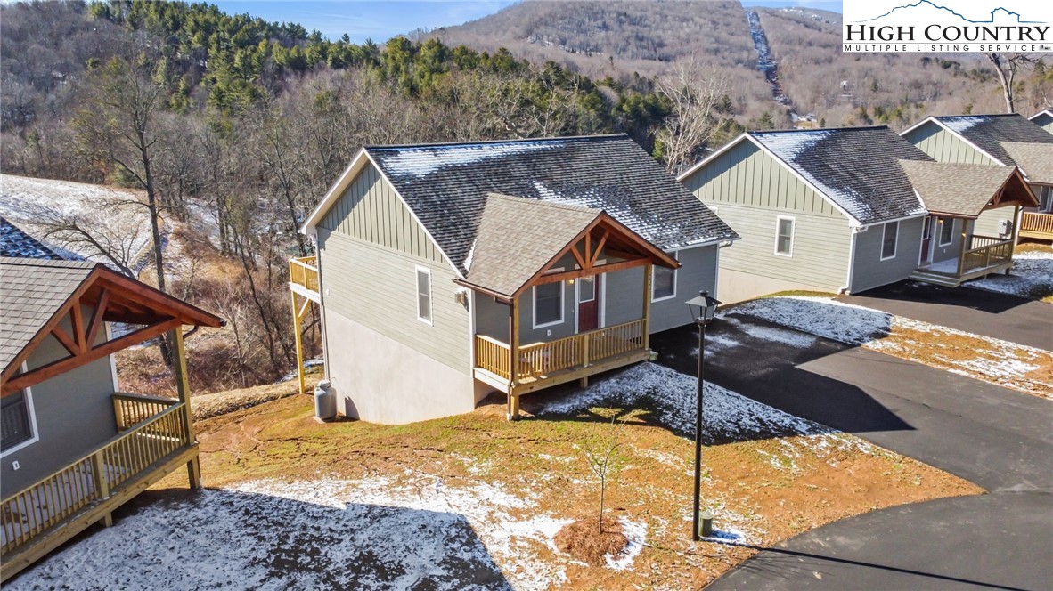 245 Ava Way, Unit 108 Boone, NC 28607 - Photo 25 of 29 a view of house with yard