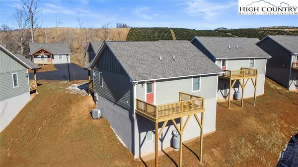 an aerial view of a house with garden space and sitting space