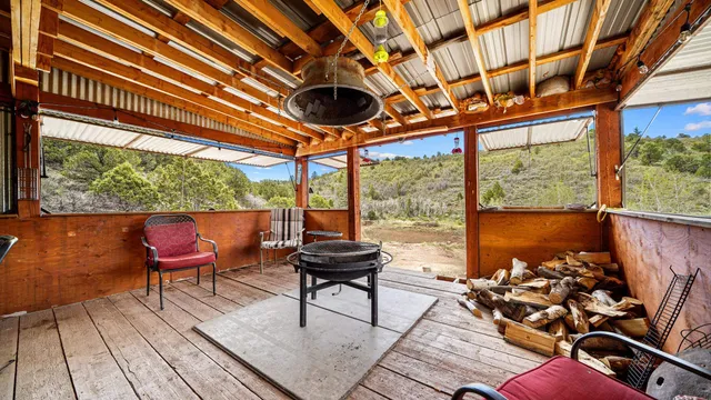 a dining room with furniture a chandelier and a rug