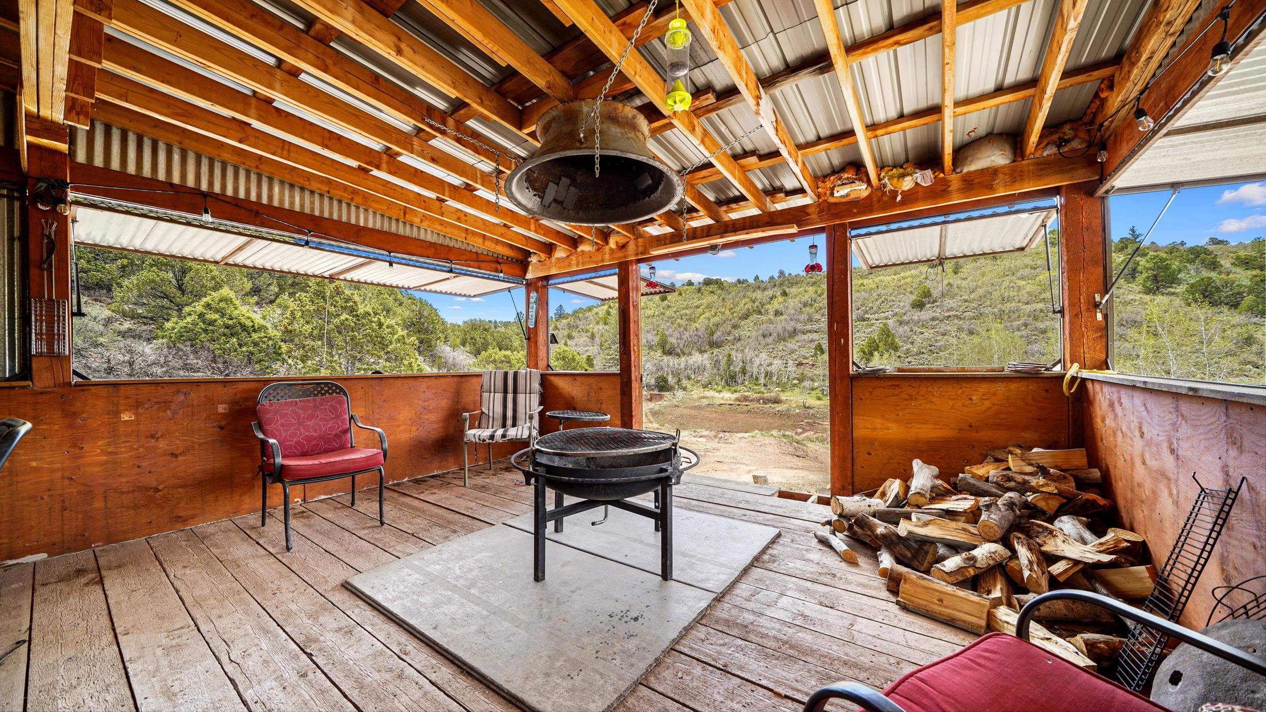 7465 Uncompahgre Divide Road Whitewater, CO 81527 - Photo 13 of 41 a view of a chairs and table in a patio