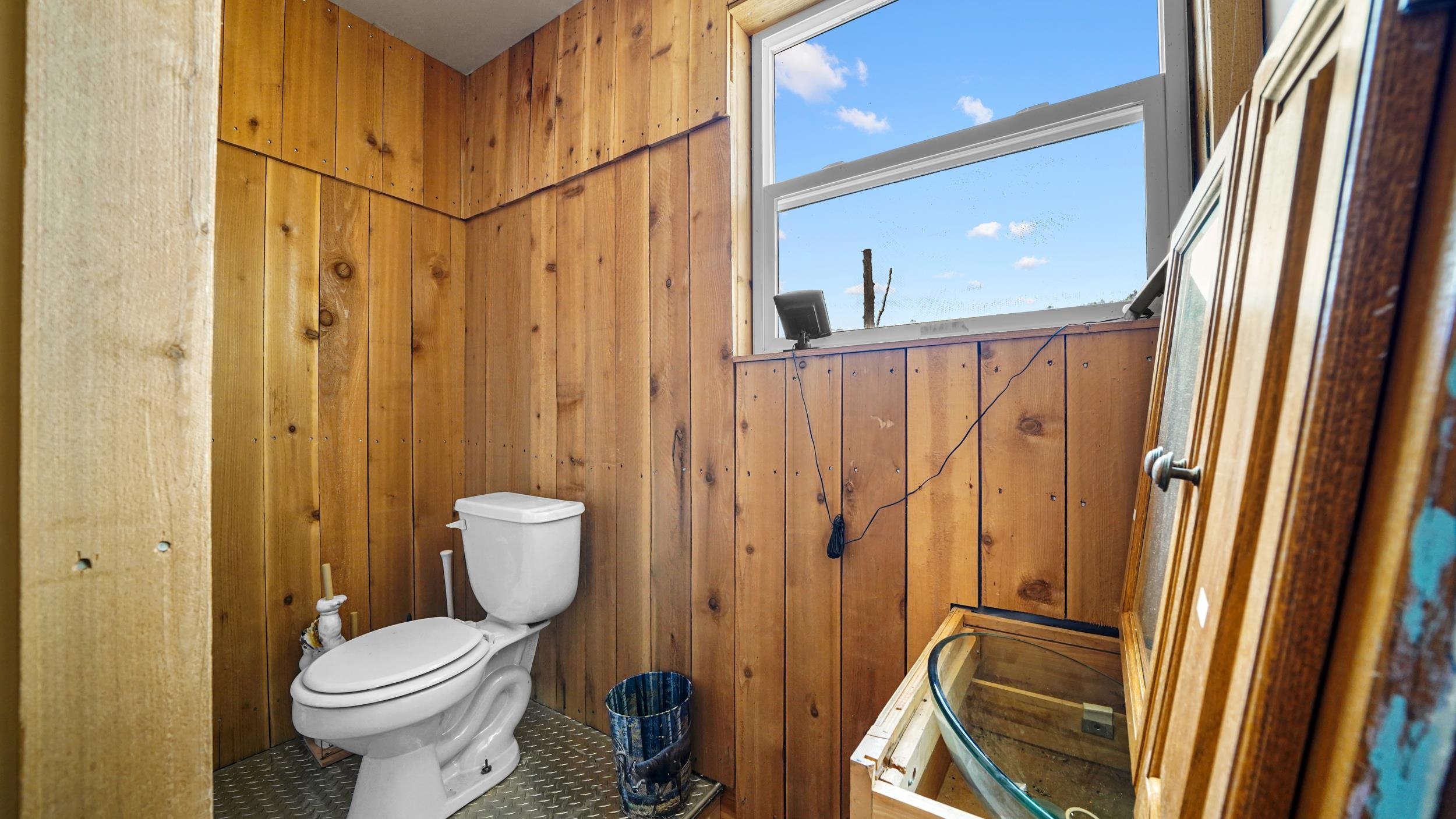 7465 Uncompahgre Divide Road Whitewater, CO 81527 - Photo 17 of 41 a bathroom with a toilet sink shower and mirror