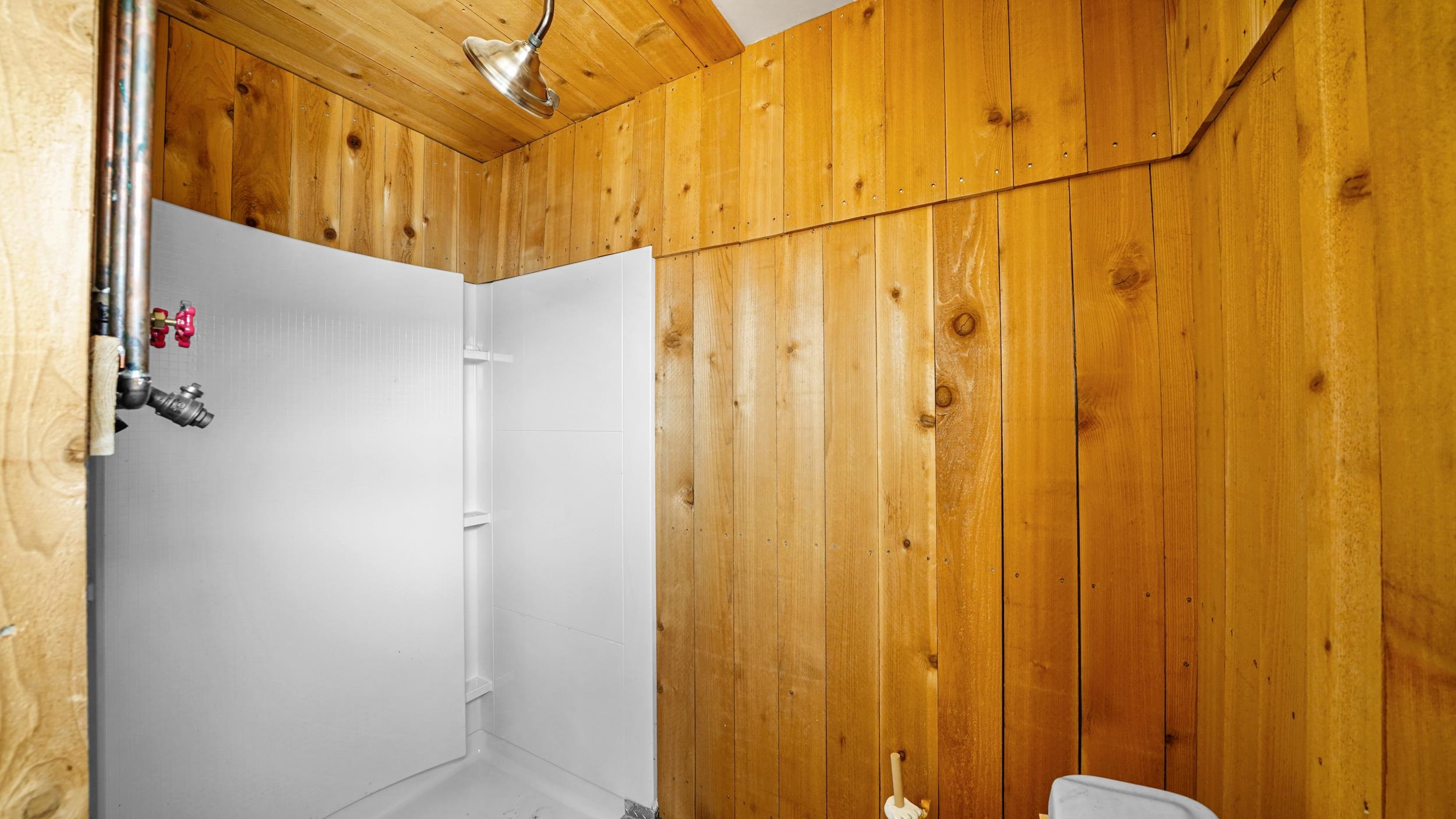 7465 Uncompahgre Divide Road Whitewater, CO 81527 - Photo 18 of 41 a bathroom with a shower curtain