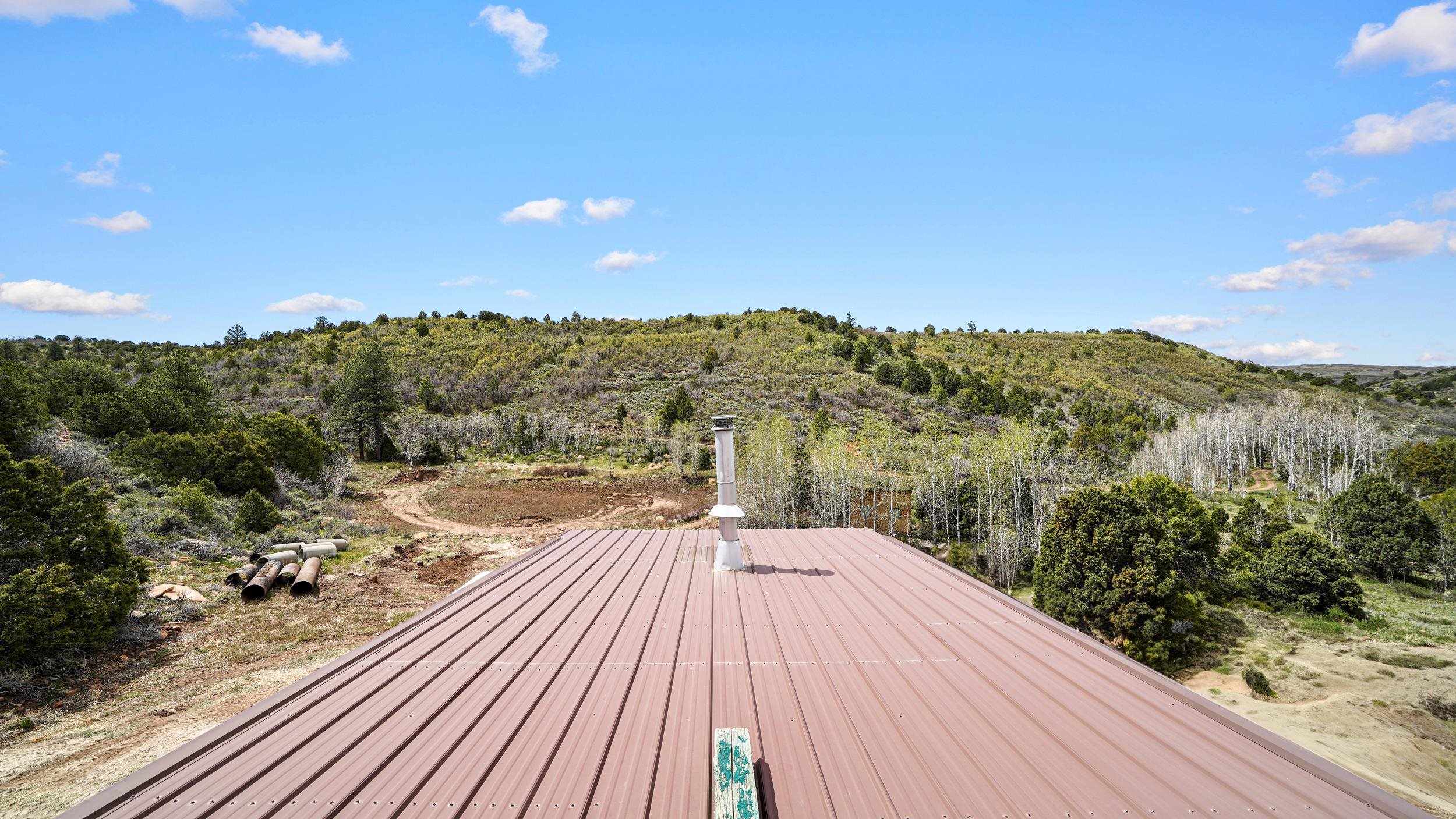 7465 Uncompahgre Divide Road Whitewater, CO 81527 - Photo 22 of 41 a view of a balcony with chair and wooden floor