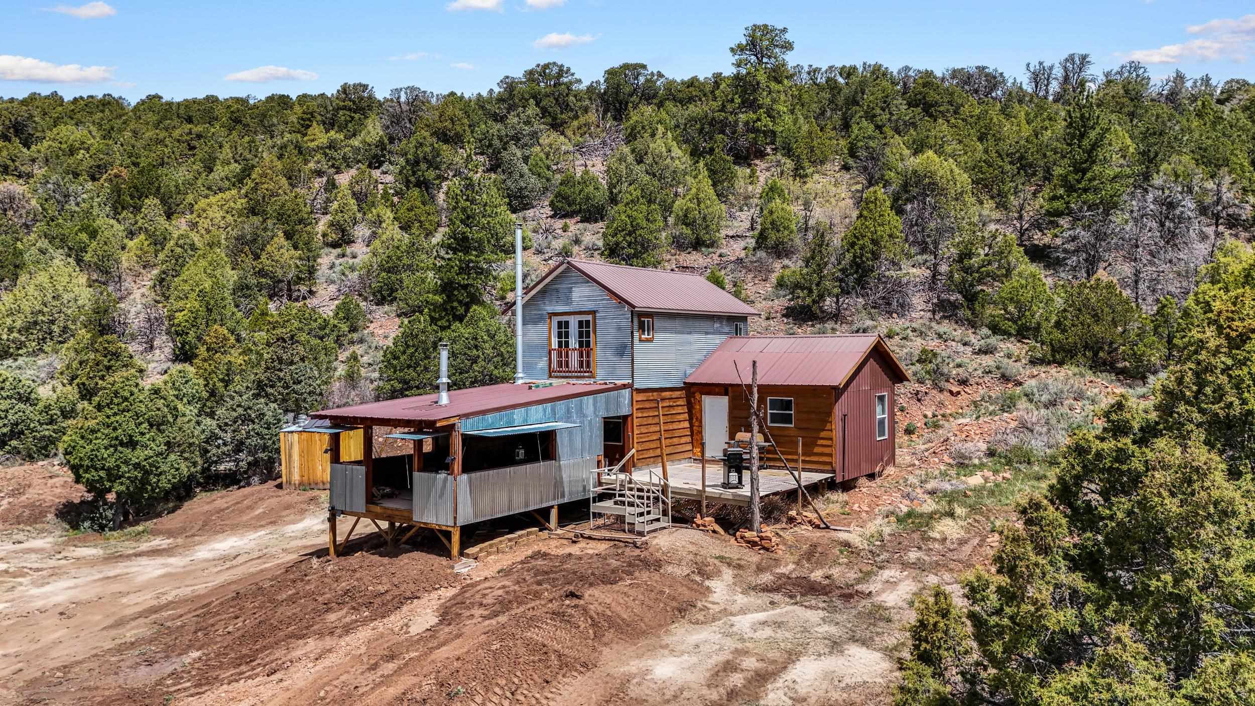 7465 Uncompahgre Divide Road Whitewater, CO 81527 - Photo 23 of 41 an aerial view of a house with a yard table and chairs