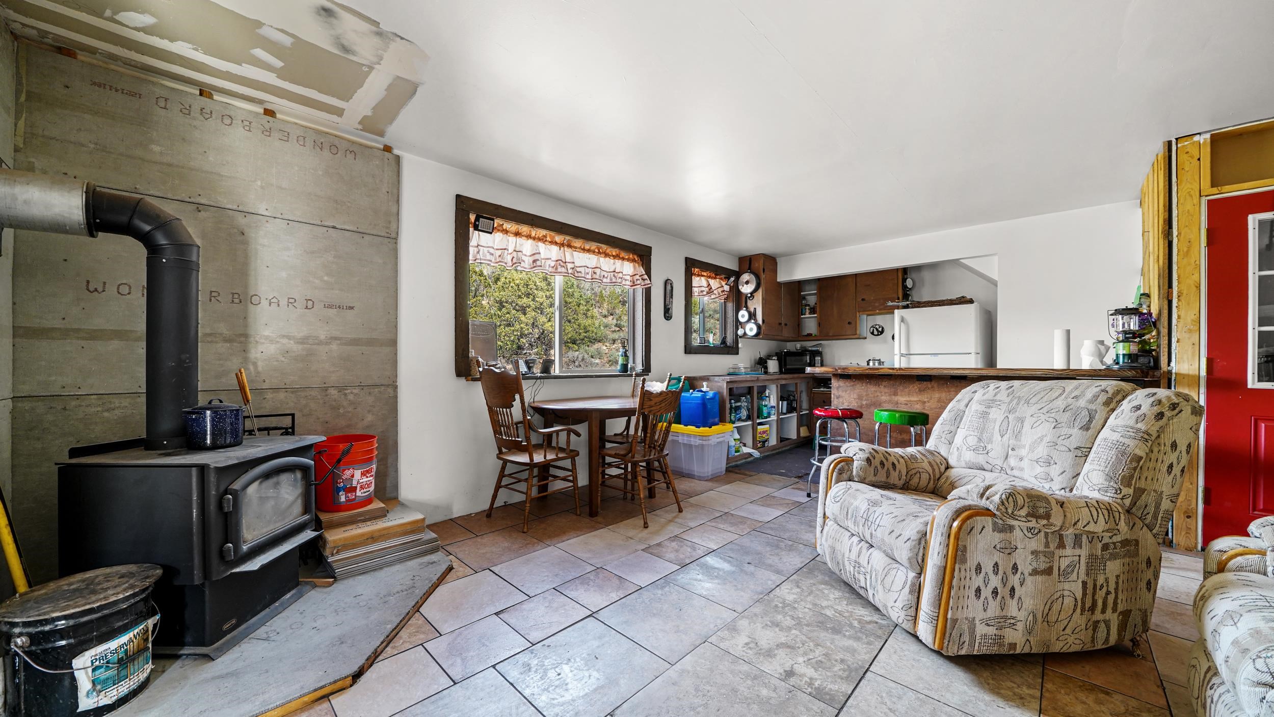 7465 Uncompahgre Divide Road Whitewater, CO 81527 - Photo 27 of 41 a living room with furniture a flat screen tv and a window