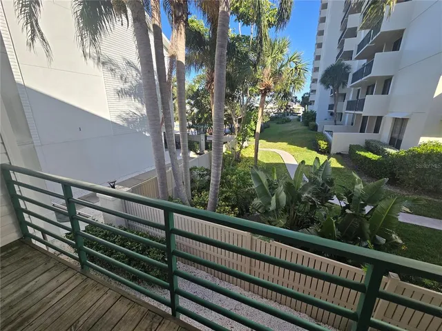 a bed room with a bed and a chair