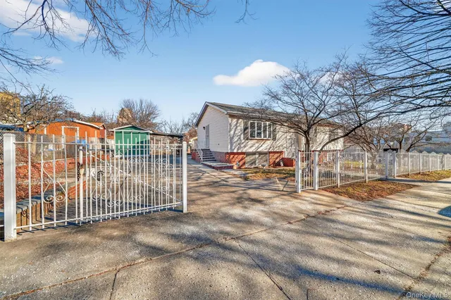 a view of a wrought iron fences in front of house