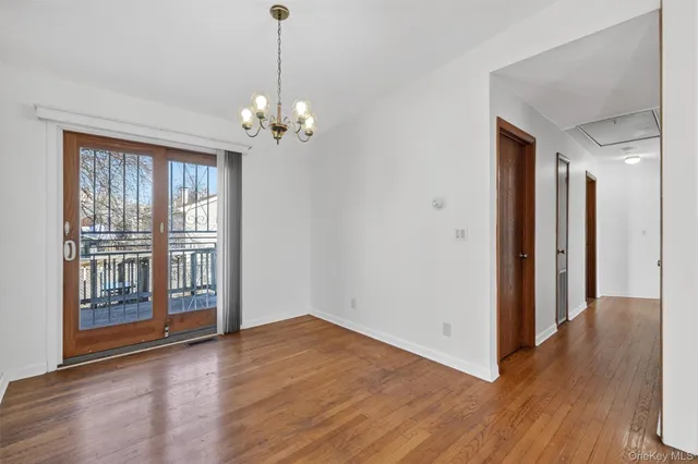 a view of a livingroom with wooden floor