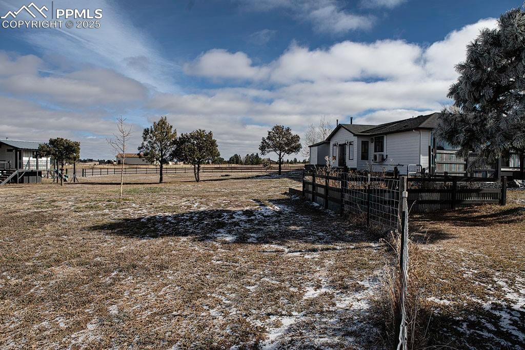 5630 Ramblin Rose Road Colorado Springs, CO 80908 - Photo 17 of 29 Back yard with playhouse