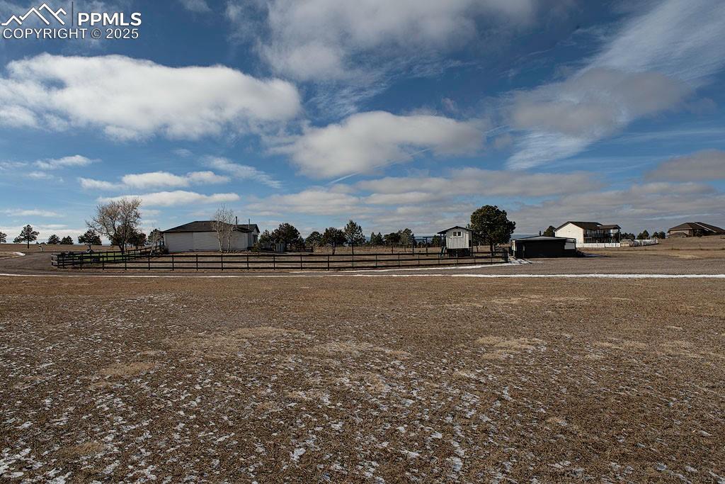 5630 Ramblin Rose Road Colorado Springs, CO 80908 - Photo 22 of 29 Property side view of fenced backyard