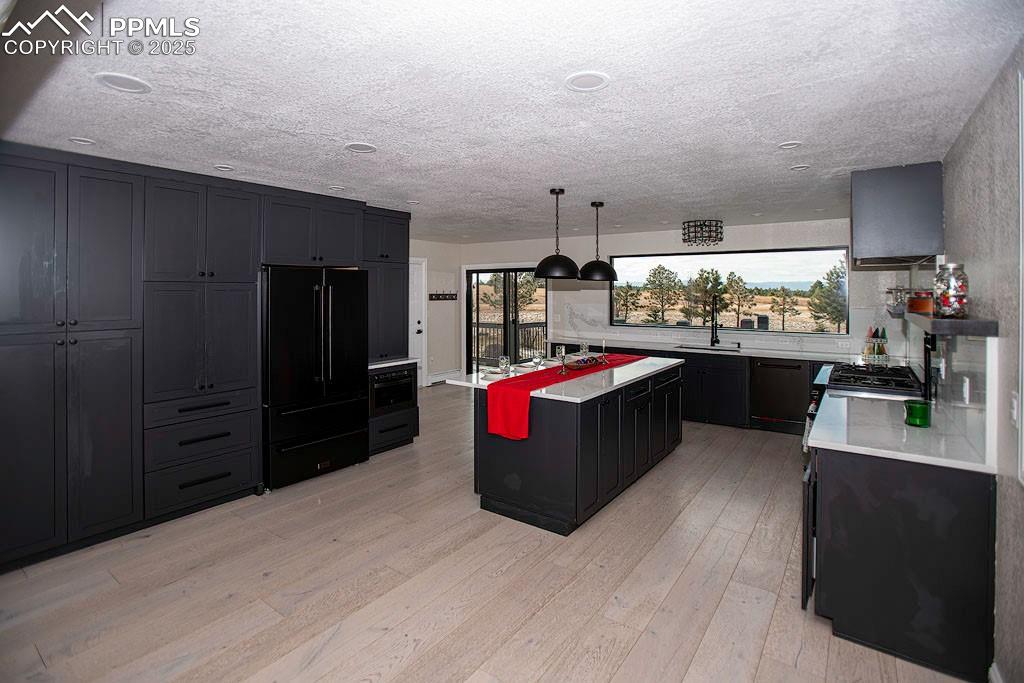 5630 Ramblin Rose Road Colorado Springs, CO 80908 - Photo 7 of 29 Kitchen with view of the mountains