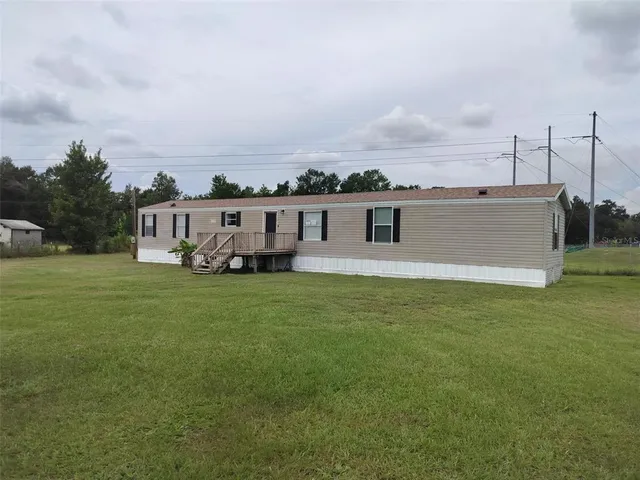 an aerial view of a house with a garden