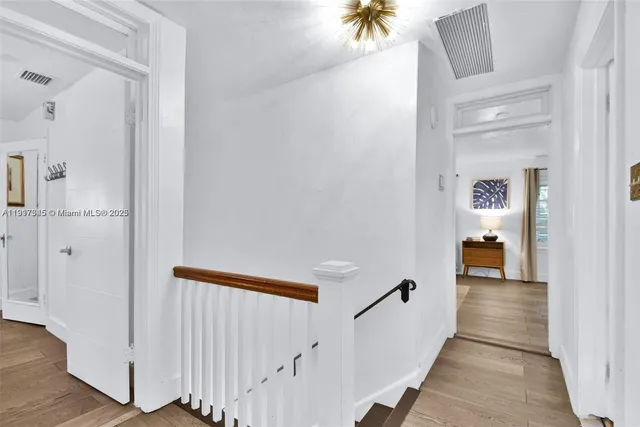 a bedroom with a large bed and a couch