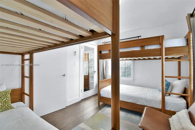 a bedroom with a bed and a television