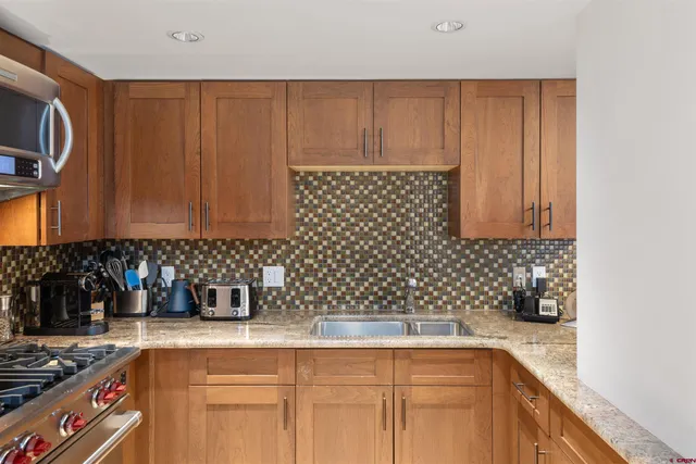 a kitchen with a sink and cabinets