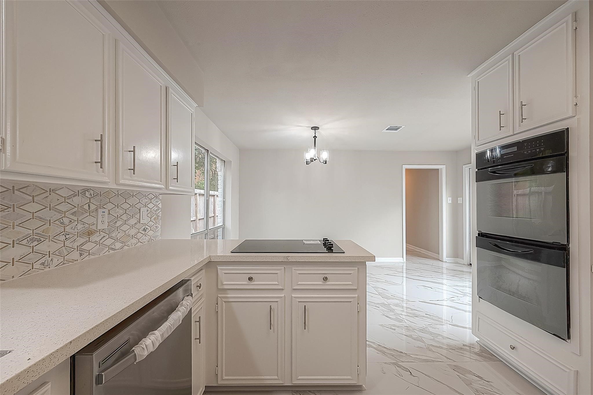 10811 Villa Lea Lane Houston, TX 77071 - Photo 11 of 34 a kitchen with granite countertop a refrigerator stove and sink
