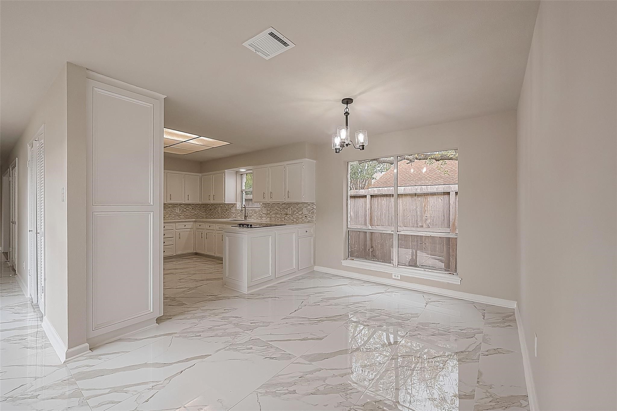 10811 Villa Lea Lane Houston, TX 77071 - Photo 12 of 34 a view of a kitchen with refrigerator and cabinets