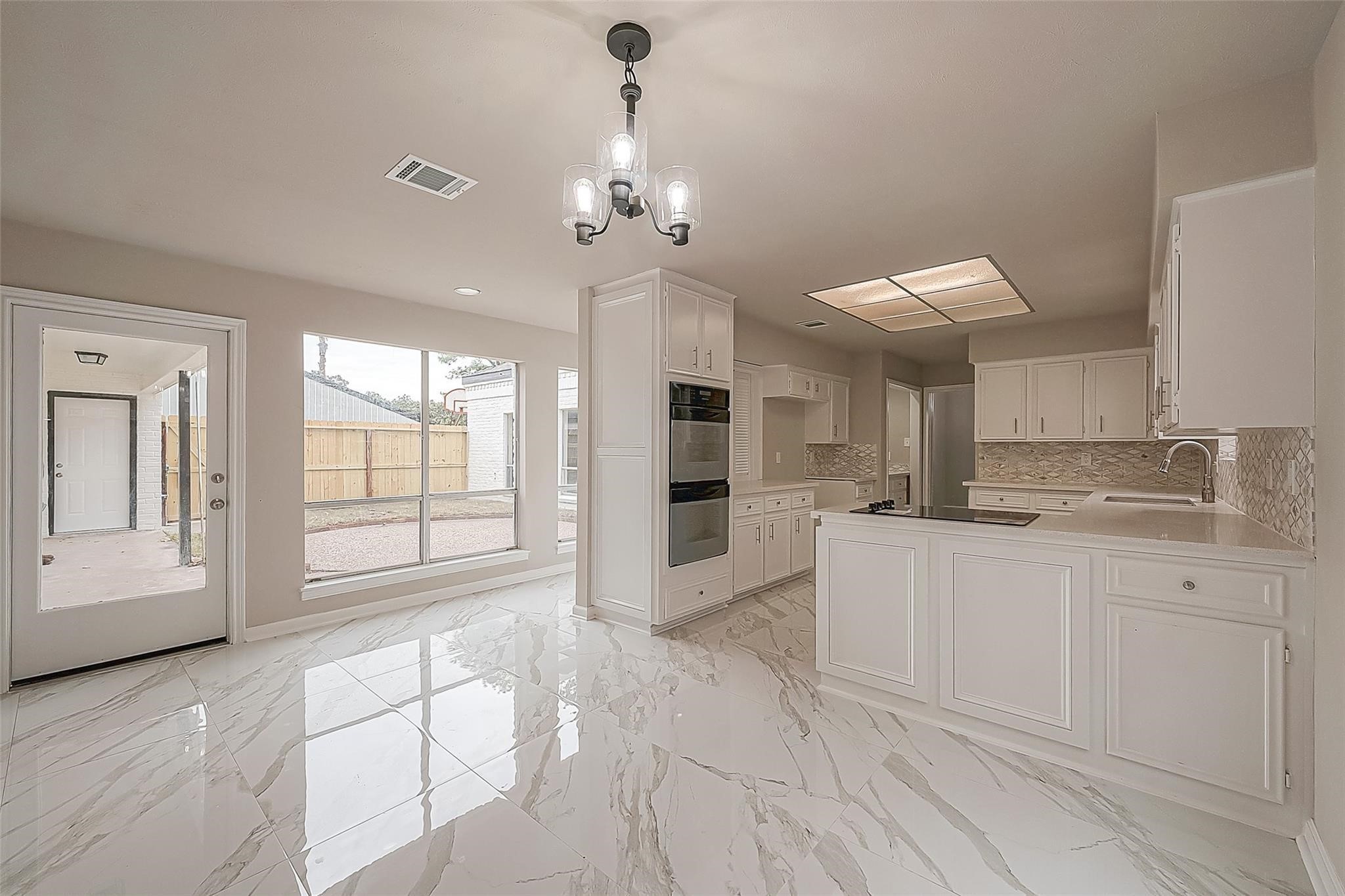 10811 Villa Lea Lane Houston, TX 77071 - Photo 13 of 34 a large white kitchen with granite countertop lots of counter top space