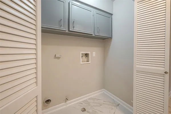 a bathroom with a sink double vanity and a toilet
