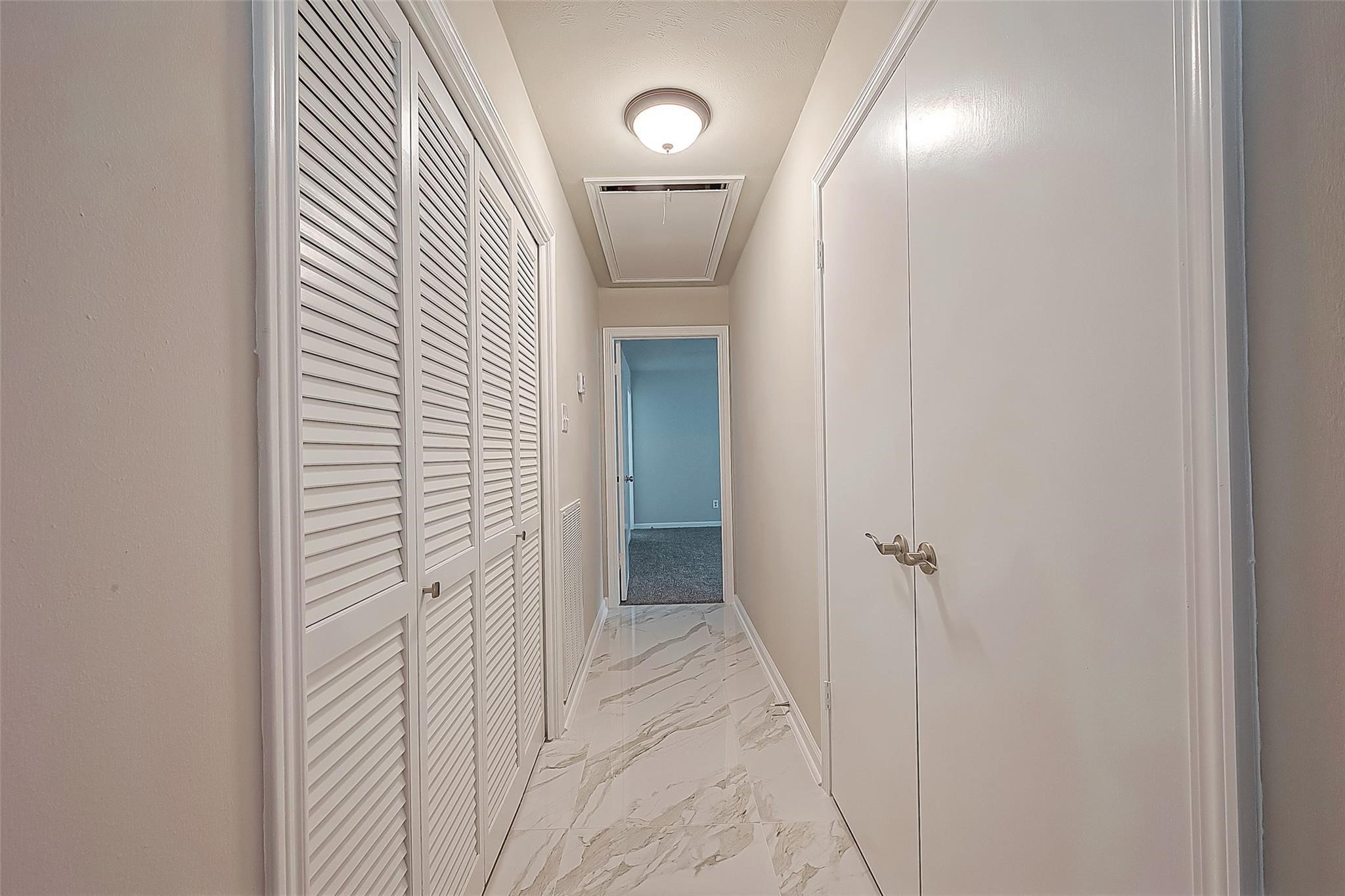 10811 Villa Lea Lane Houston, TX 77071 - Photo 25 of 34 a view of a hallway with a door