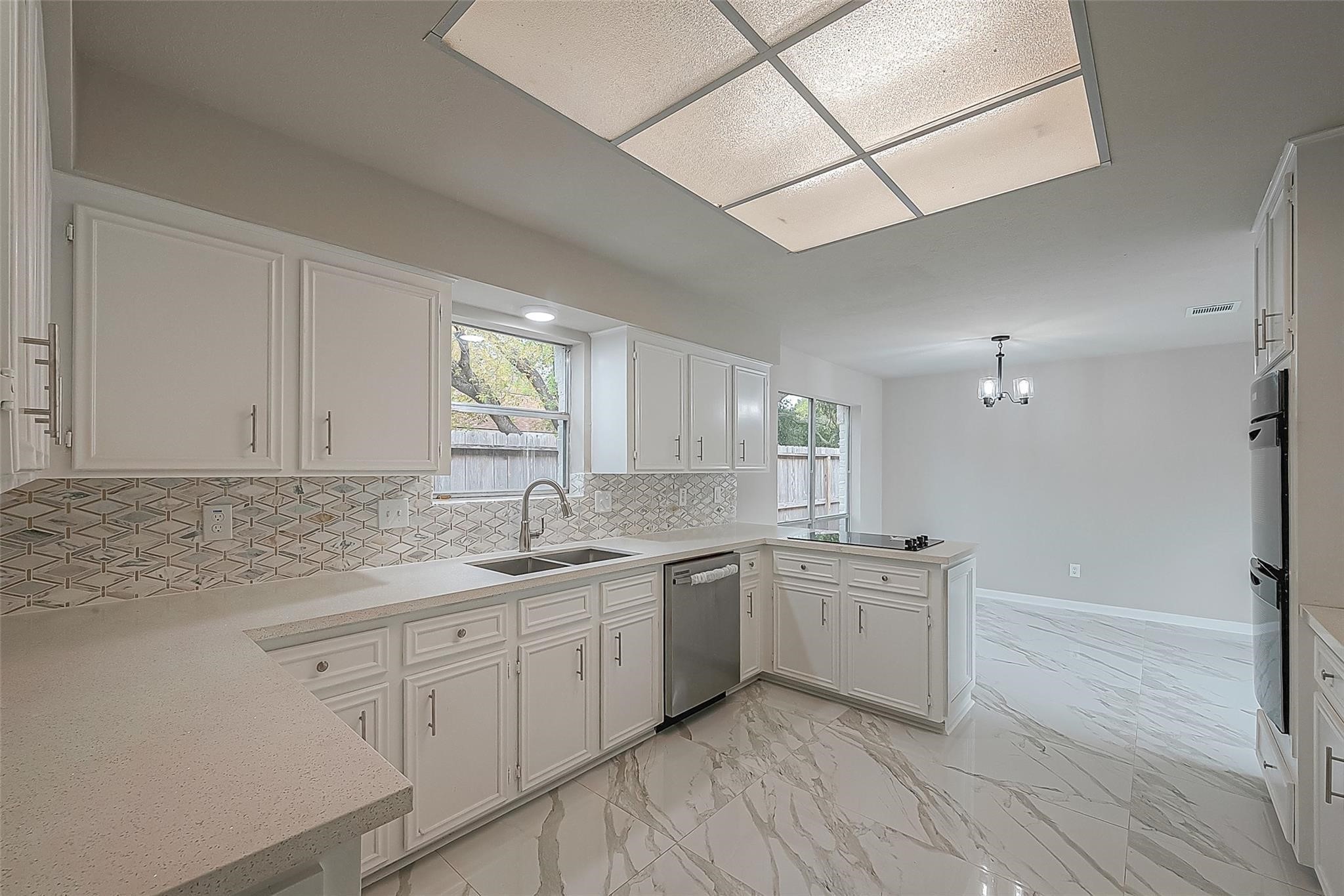 10811 Villa Lea Lane Houston, TX 77071 - Photo 10 of 34 a kitchen with a sink stove and cabinets