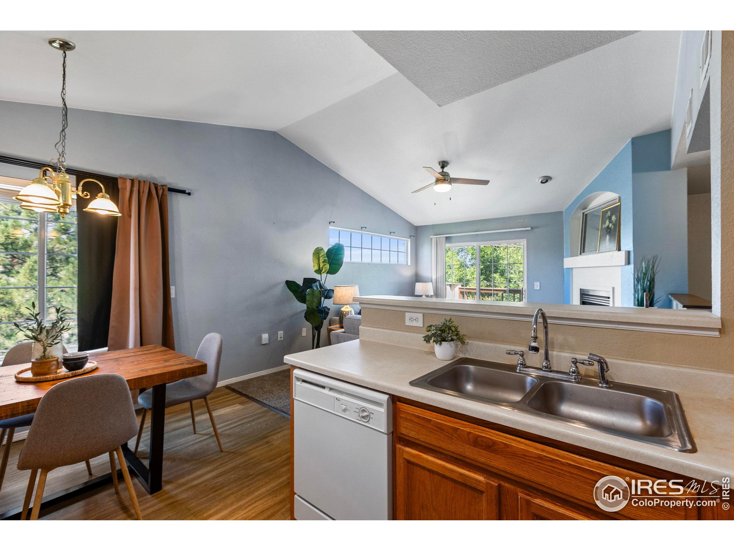 3002 West Elizabeth Street, Unit G Fort Collins, CO 80521 - Photo 13 of 28 a kitchen with a sink cabinets and a large window