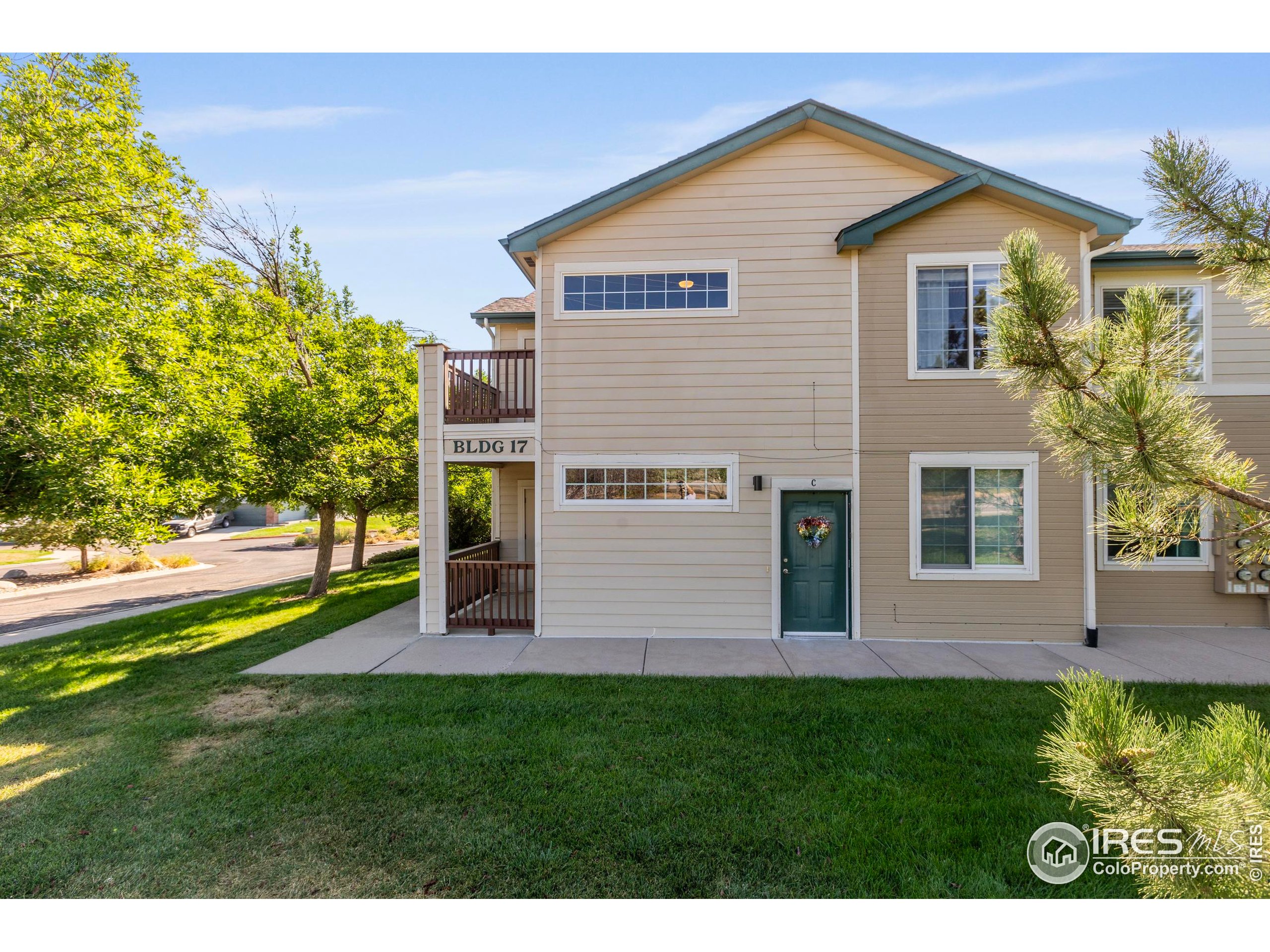 3002 West Elizabeth Street, Unit G Fort Collins, CO 80521 - Photo 24 of 28 a view of a house with a yard and sitting area