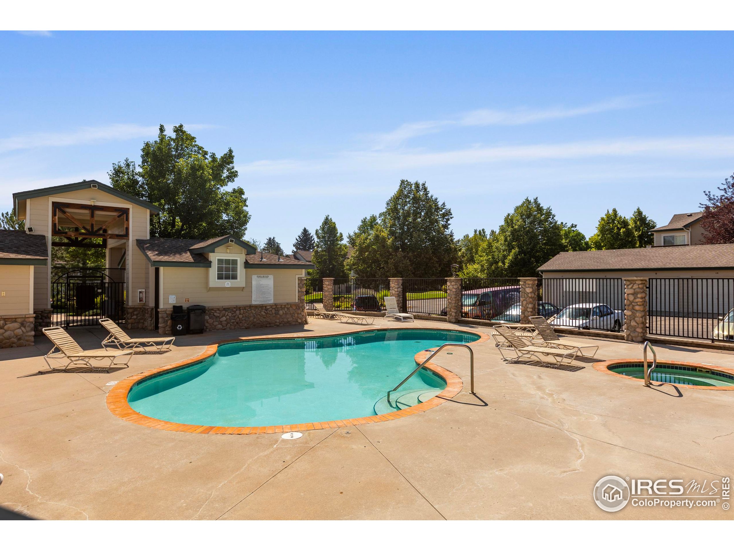 3002 West Elizabeth Street, Unit G Fort Collins, CO 80521 - Photo 26 of 28 a view of a swimming pool with lounge chairs