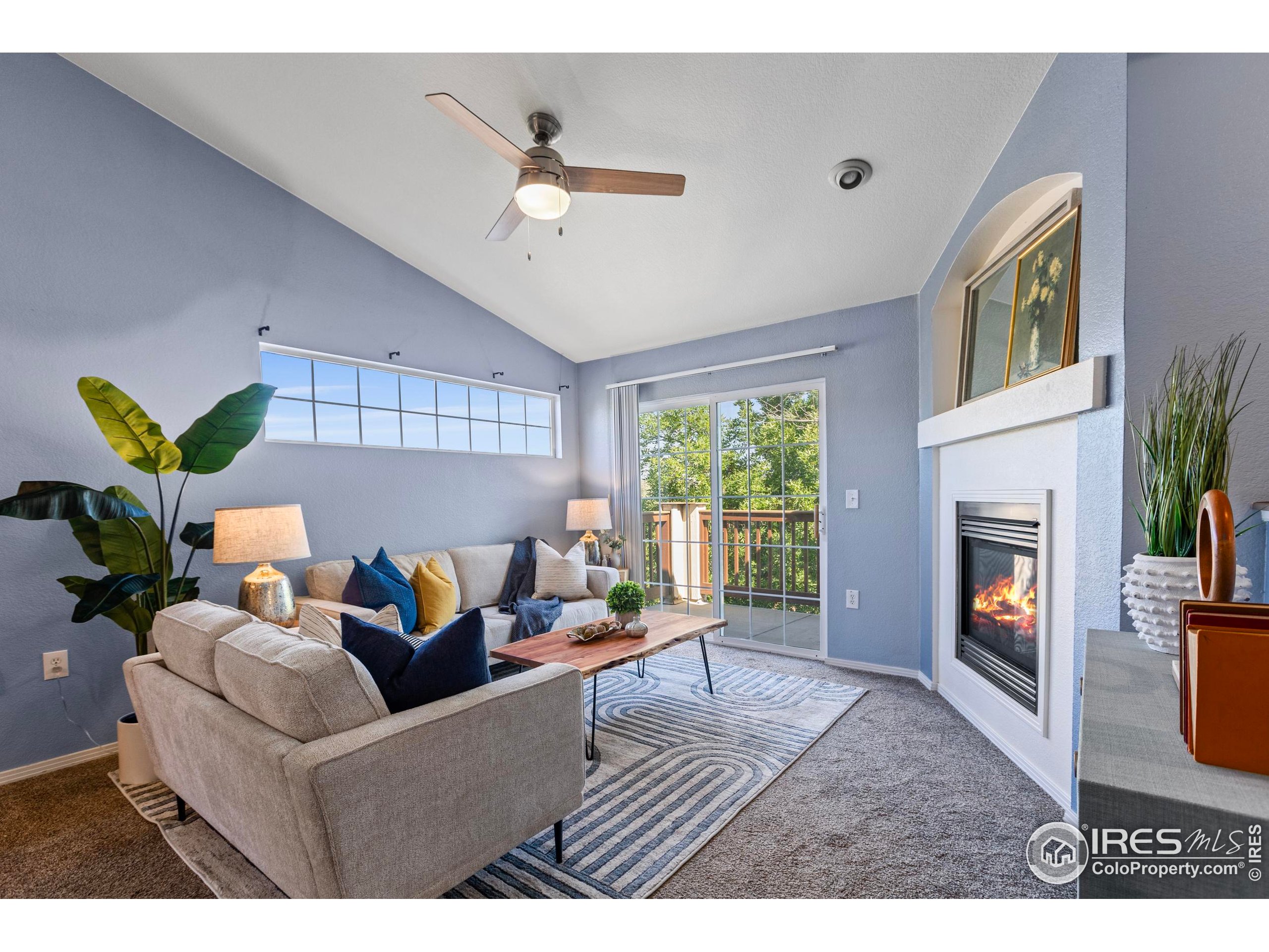 3002 West Elizabeth Street, Unit G Fort Collins, CO 80521 - Photo 4 of 28 a living room with furniture and a fireplace