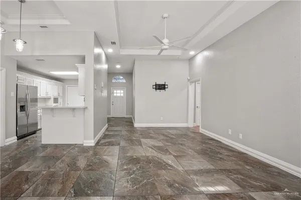 a view of a hallway with a kitchen